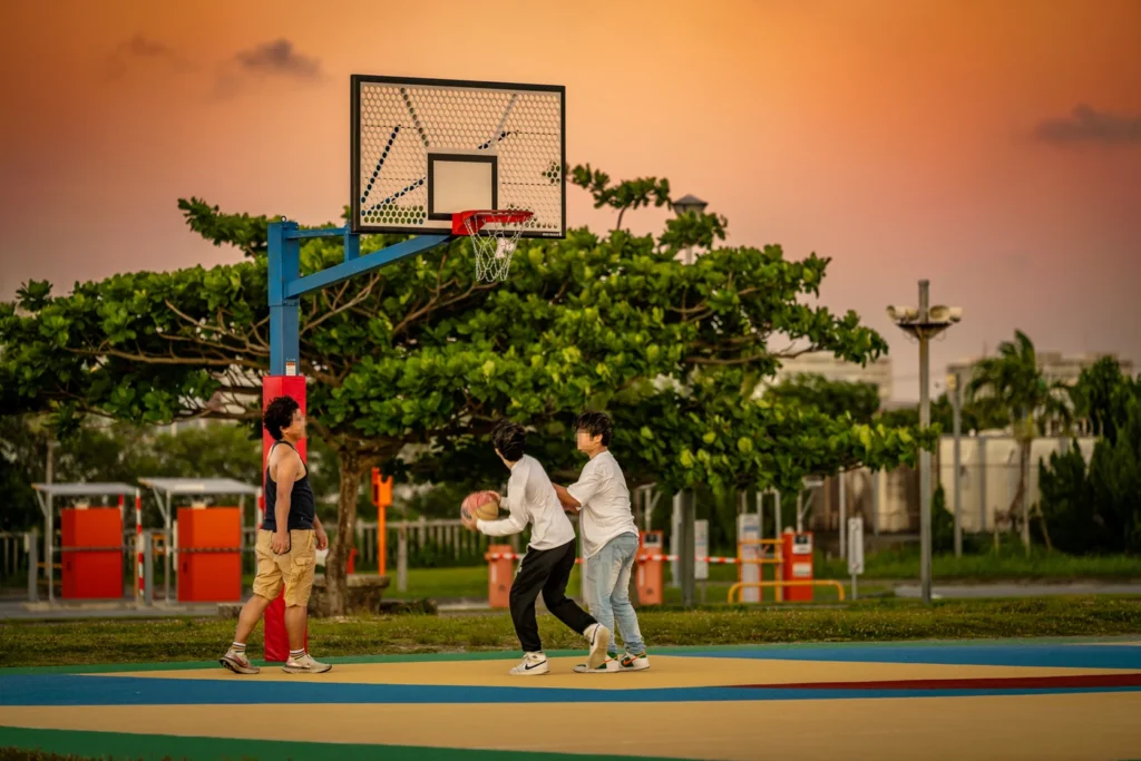 People playing basketball on the court at Itoman Beach, Okinawa, on 16th June 2025