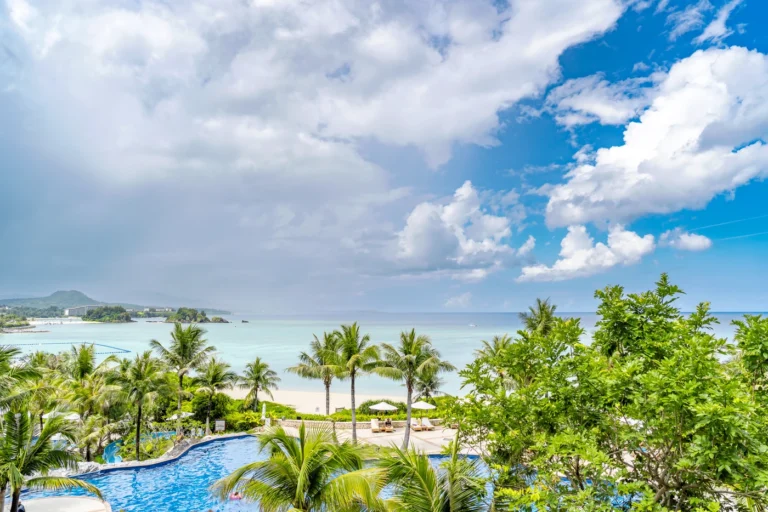 On 16th August 2025, the weather in Okinawa is depicted with a photo showing a squall-like shower, where the left side of the area is experiencing rain, while the right side is very clear with a blue sky.