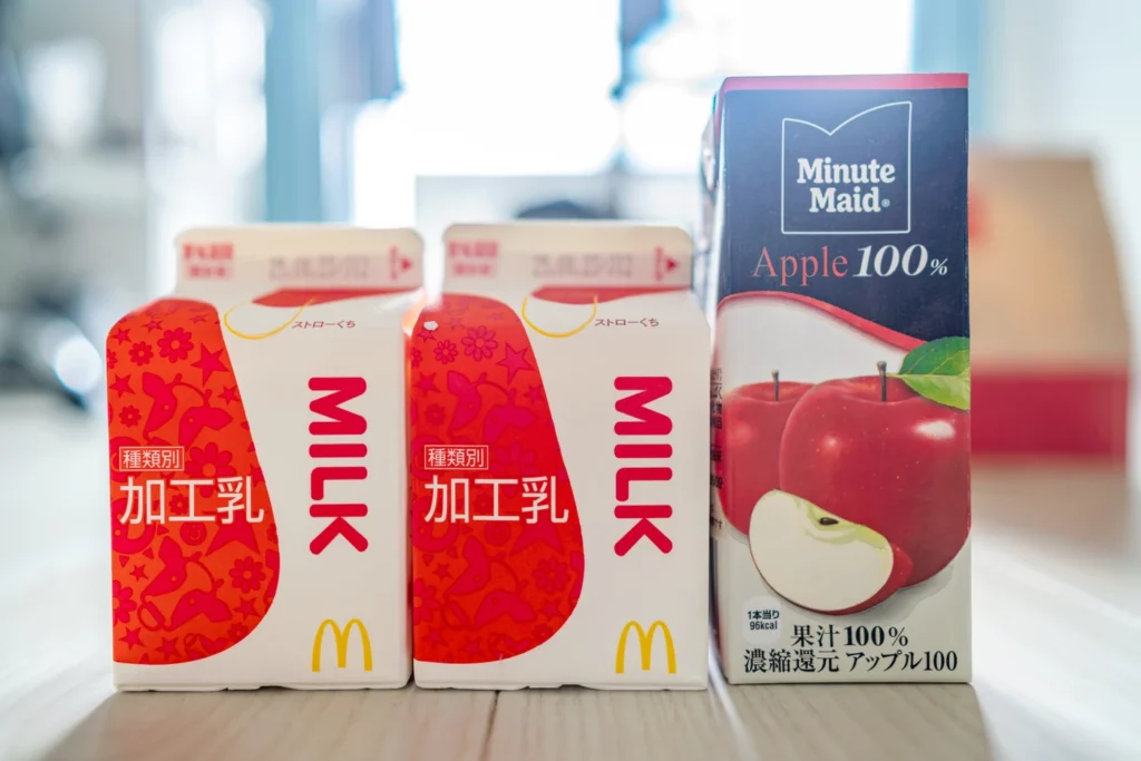 The appearance of the Pokémon toy in the Japanese McDonald's Happy Meal, along with milk and apple juice, is small as it's designed for children.