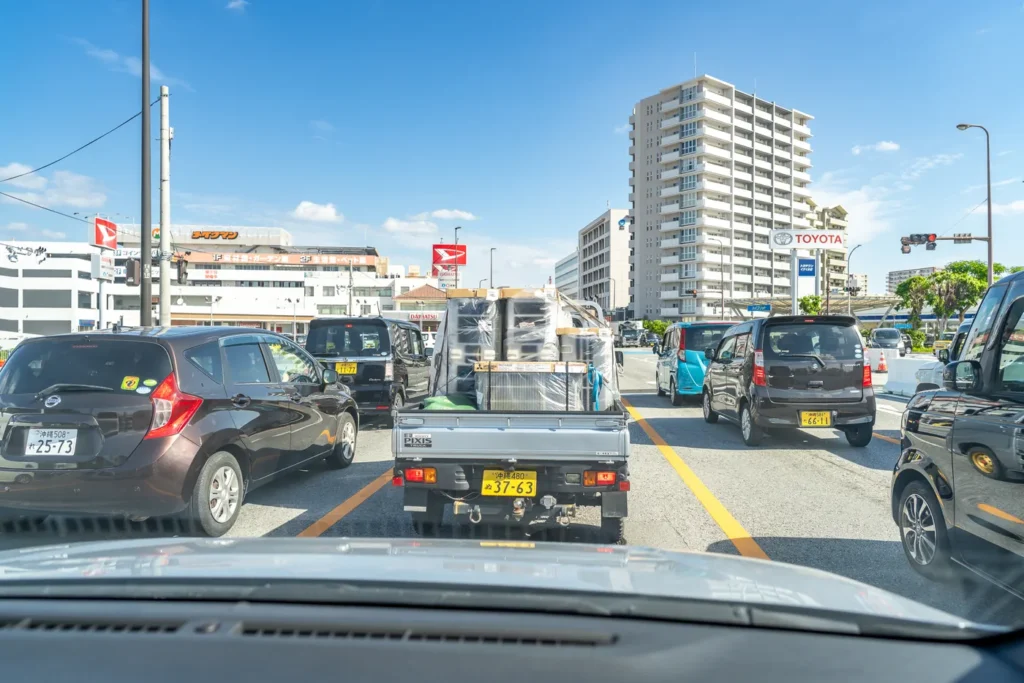 Air conditioning installation vehicle waiting at a signal in Urasoe
