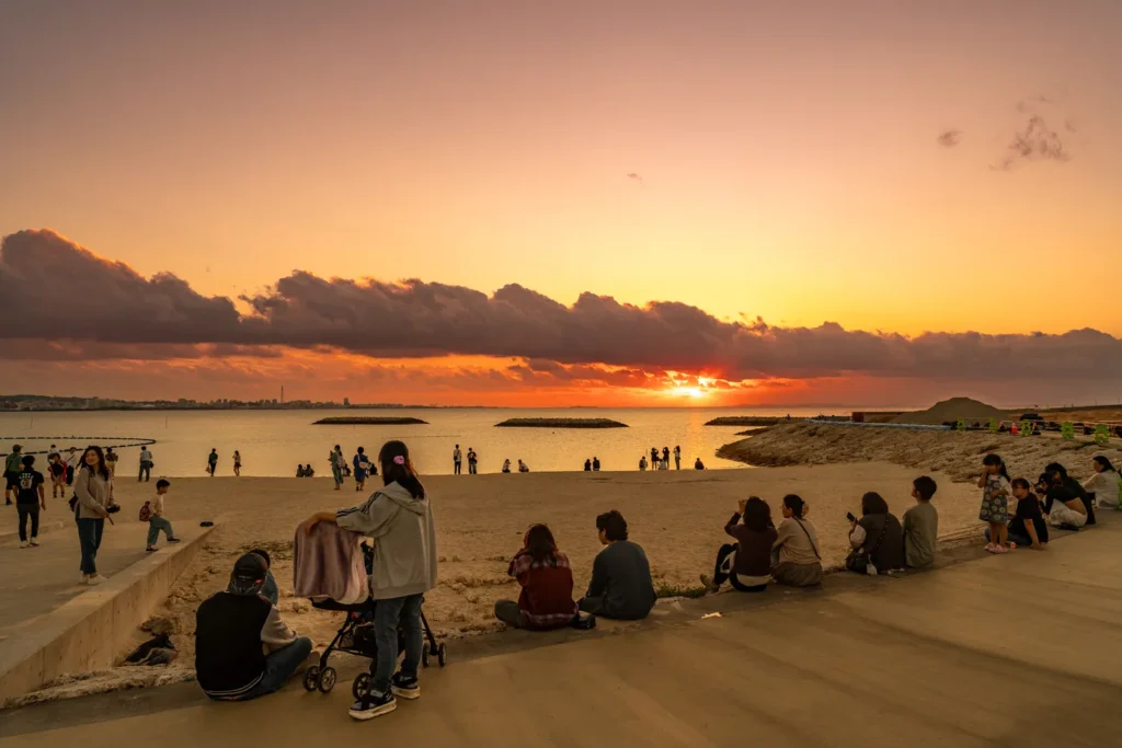 Okinawa locals watching the sunset at Sunset Beach